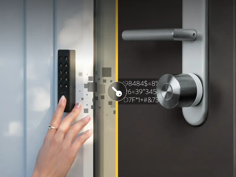 A finger on the fingerprint reader of the Nuki keypad, next to the lock